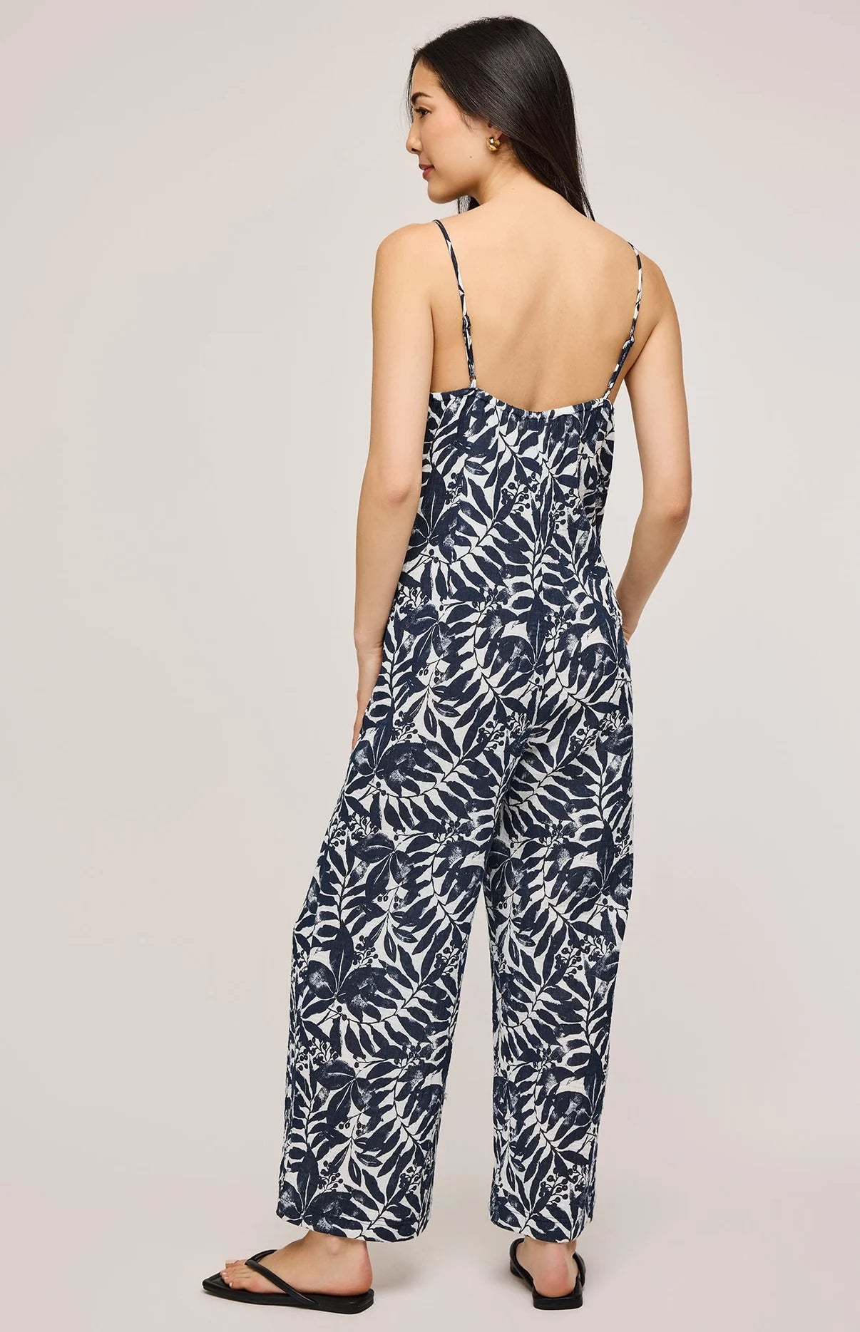 womens sleeveless jumpsuit with a tropical navy leaf pattern