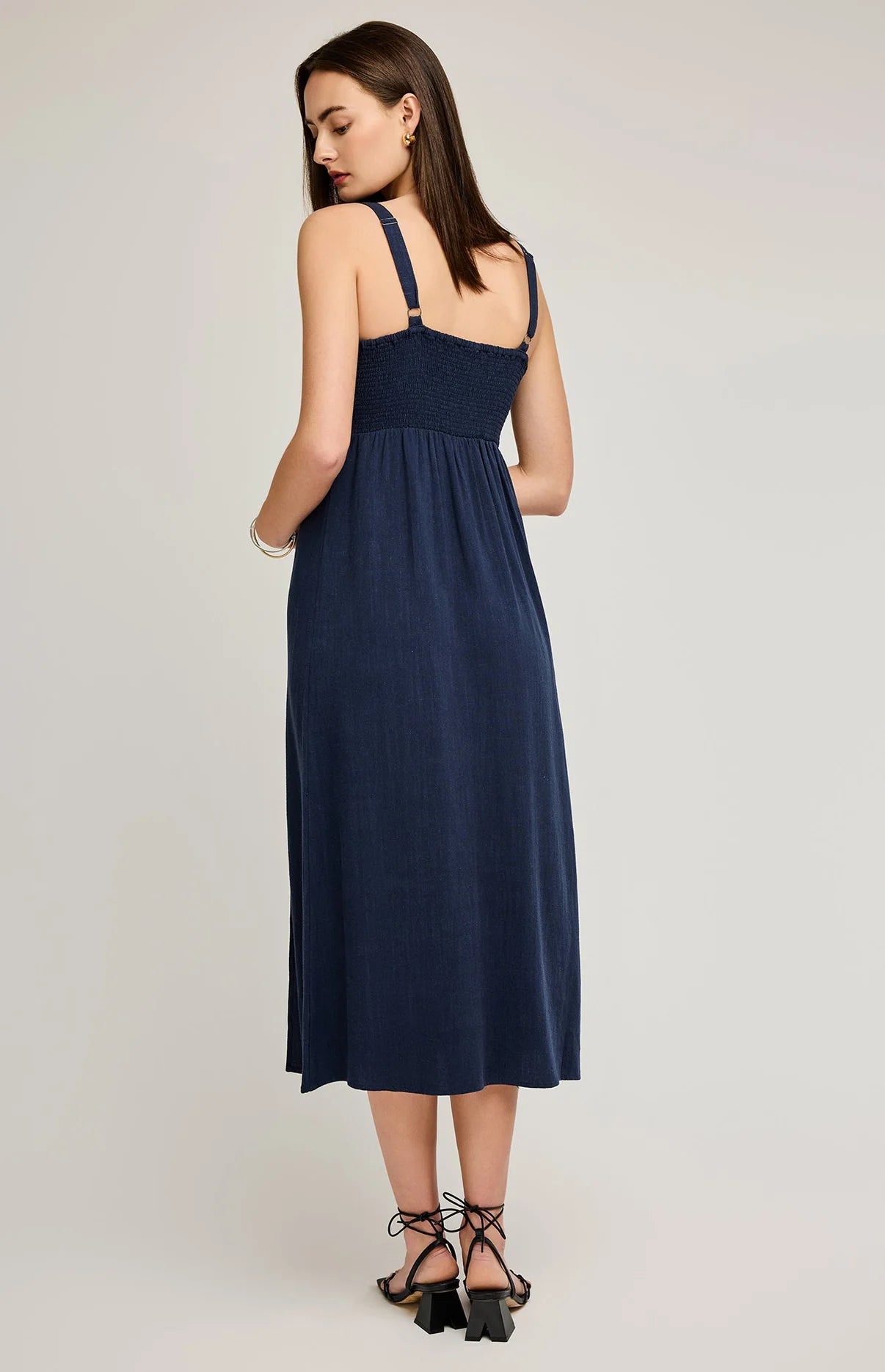 woman in navy linen dress