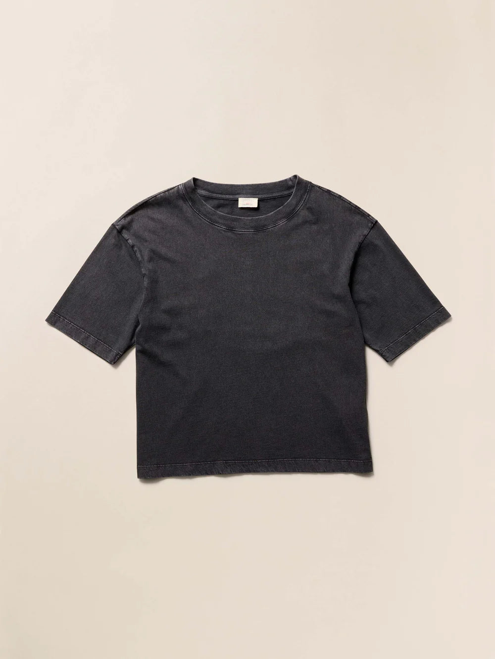 Black t-shirt on a beige background