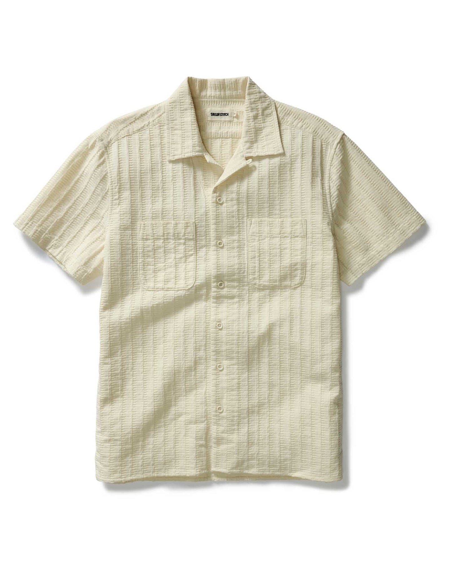 flatlay of a taylor stitch brand shirt the conrad in vintage white