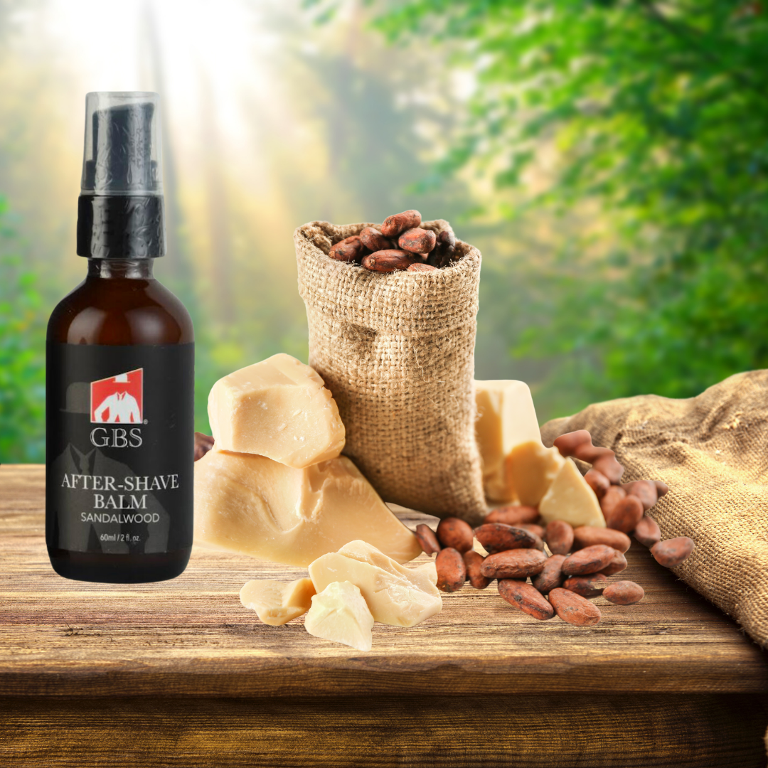 GBS after-shave balm bottle with sandalwood pieces and a bag of sandalwood on a wooden surface with a green blurred background.