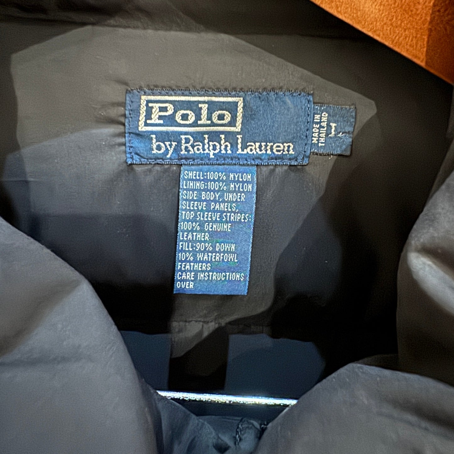 Polo by Ralph Lauren label on a jacket with specifications.