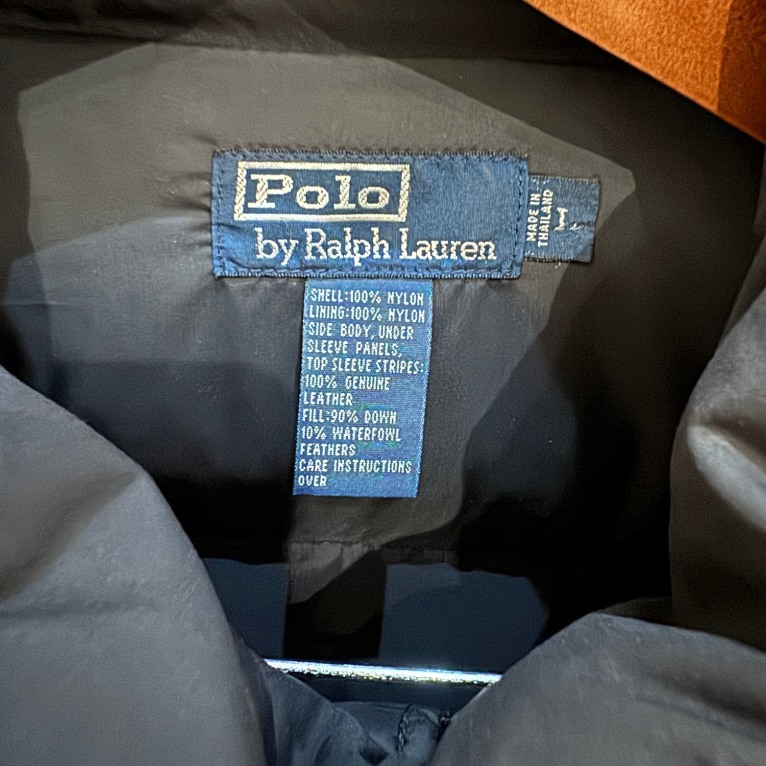 Polo by Ralph Lauren label on a jacket with specifications.