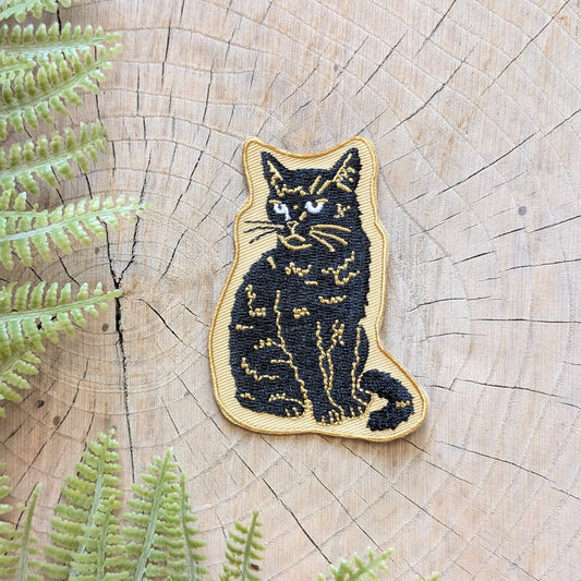 Iron-on patch | sitting black disappointed cat 2.9" x 2.2"