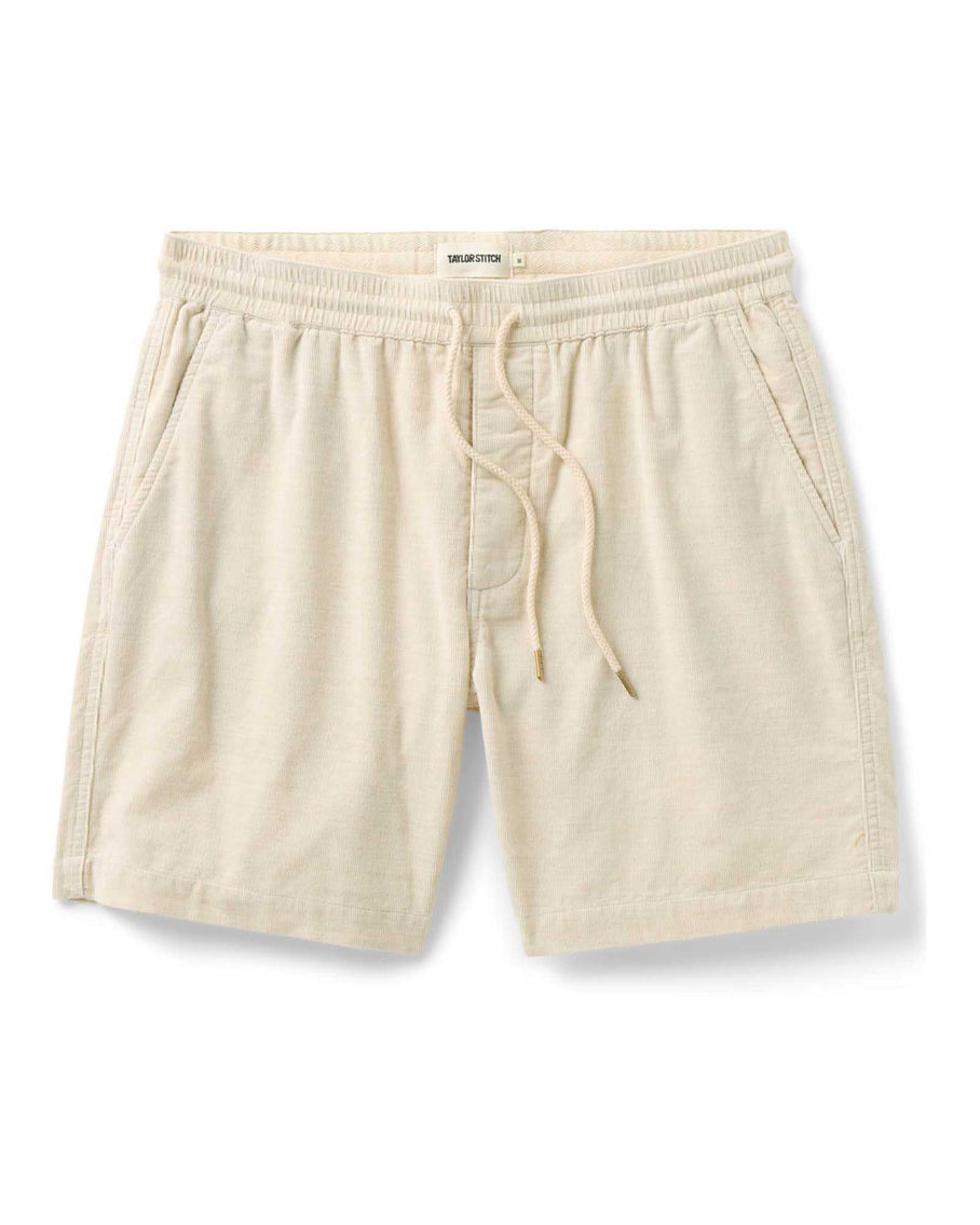 Beige shorts with drawstring on a white background