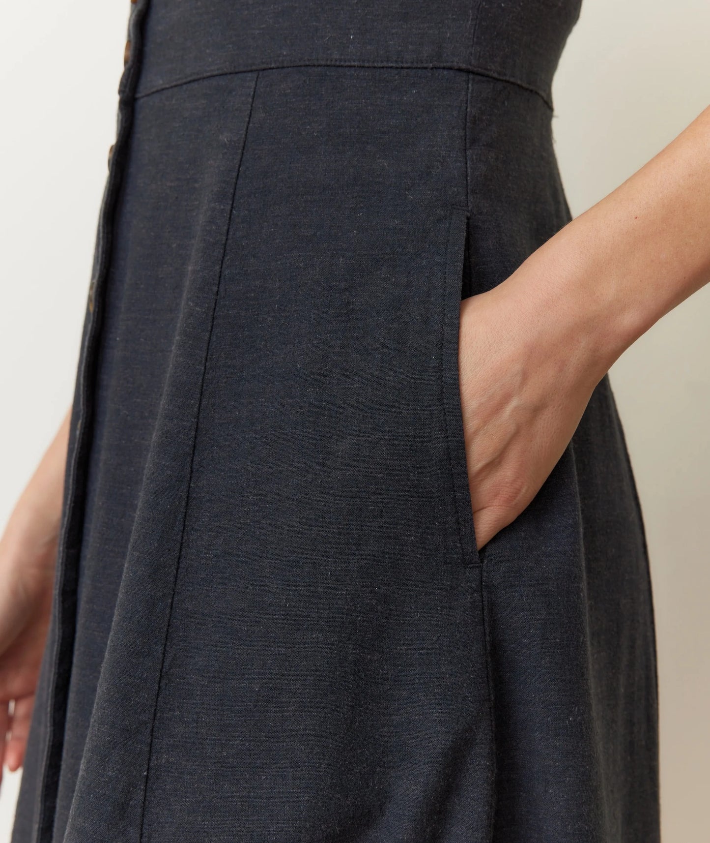 Dark gray dress with a plain background