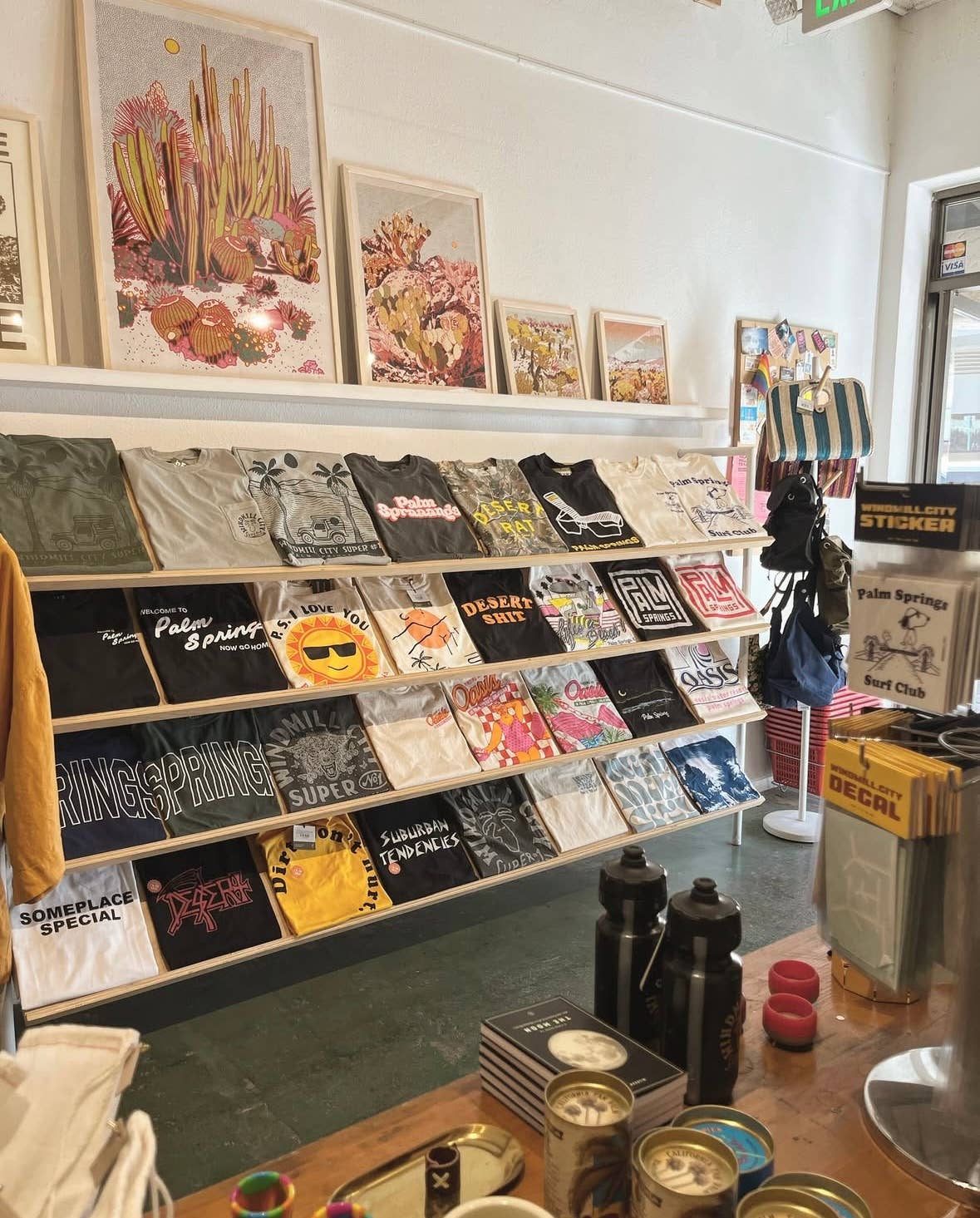 Caroline-Clark-art-print-mstgoods-colorful-landscape-art-2 displayed in a store front retail
