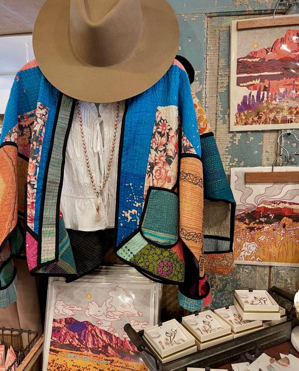 Caroline-Clark-art-print-mstgoods-colorful-landscape-art displayed in a retail space with other goods