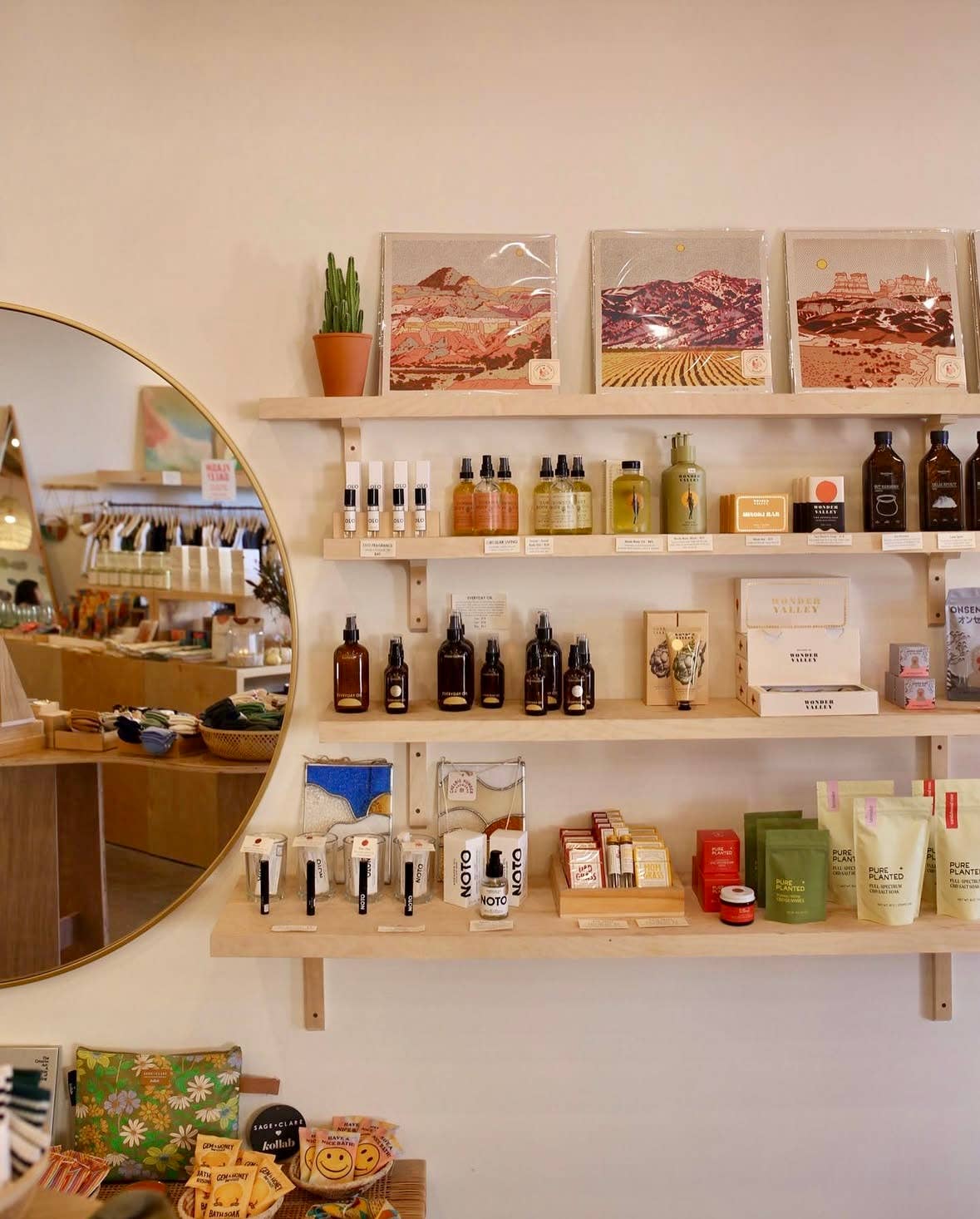 Caroline-Clark-art-prints on the wall in a retail store