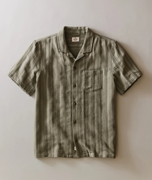 Striped short-sleeve shirt on a light background