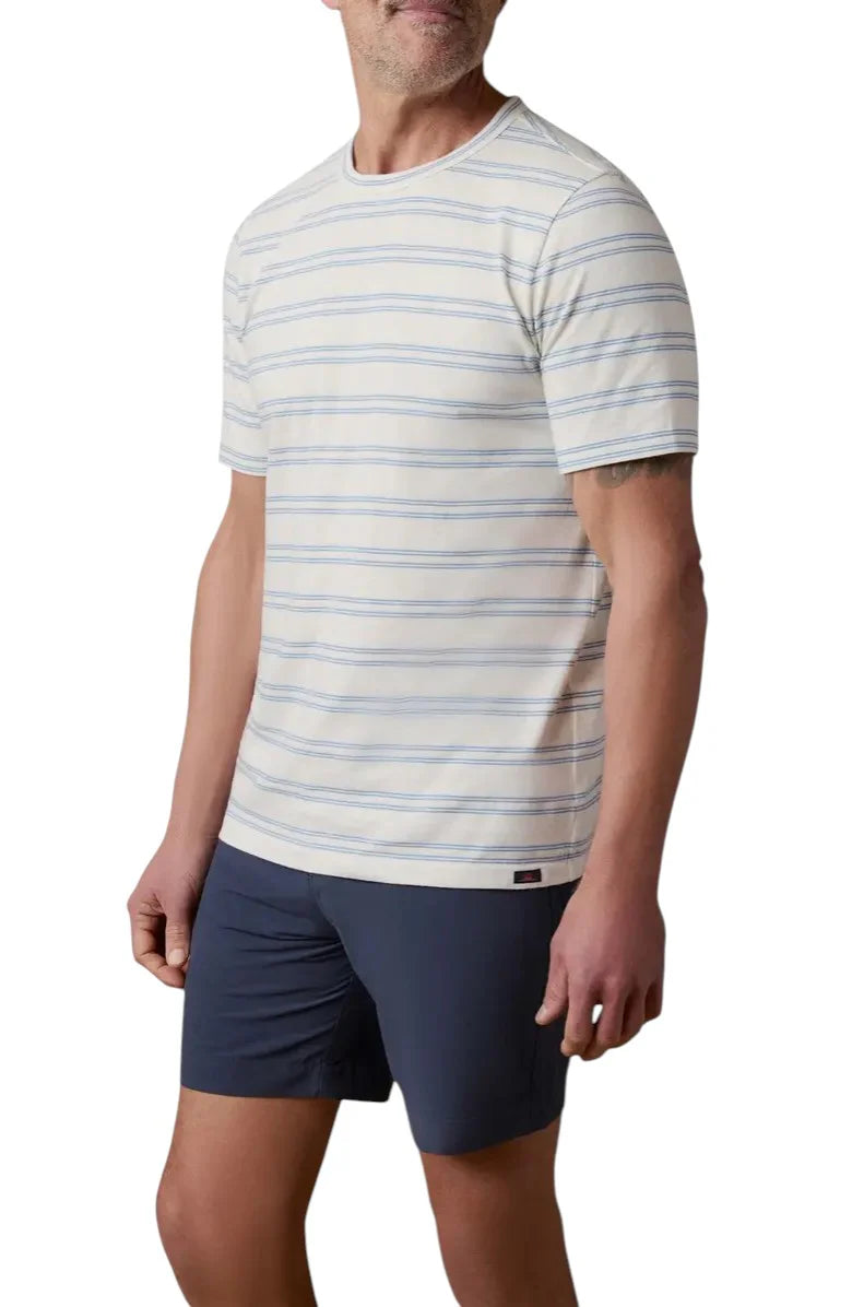 Man wearing a striped t-shirt and navy shorts on a white background