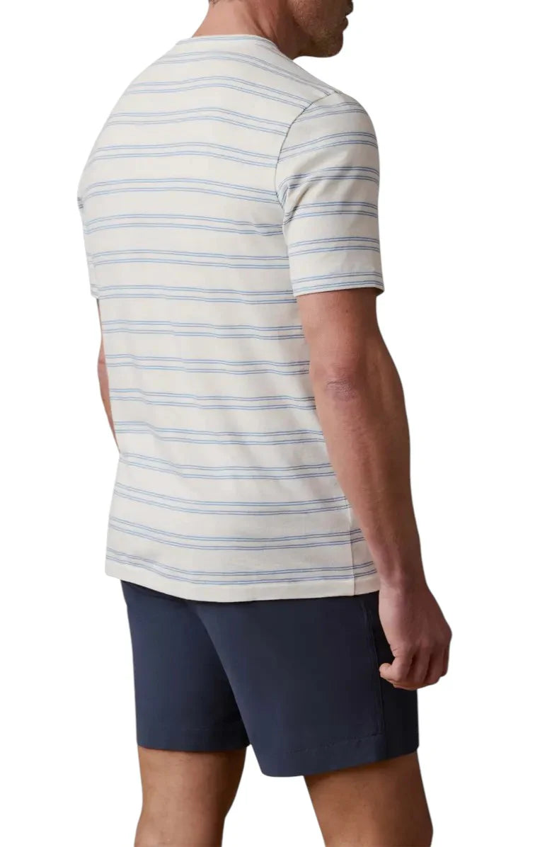 Man wearing a striped shirt and navy shorts on a white background