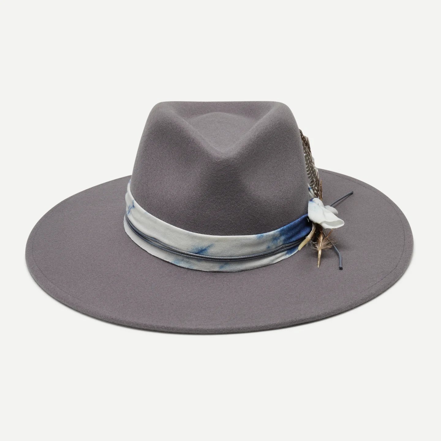 Gray fedora hat with a decorative band and feather on a white background