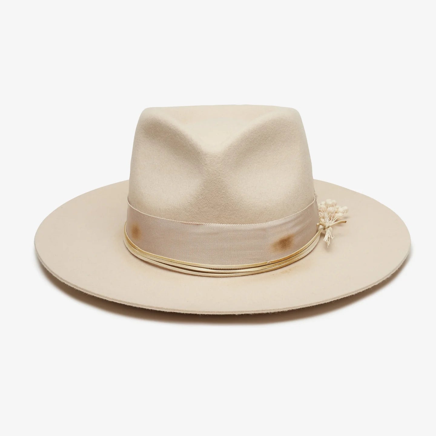 Beige fedora hat with a decorative band on a white background