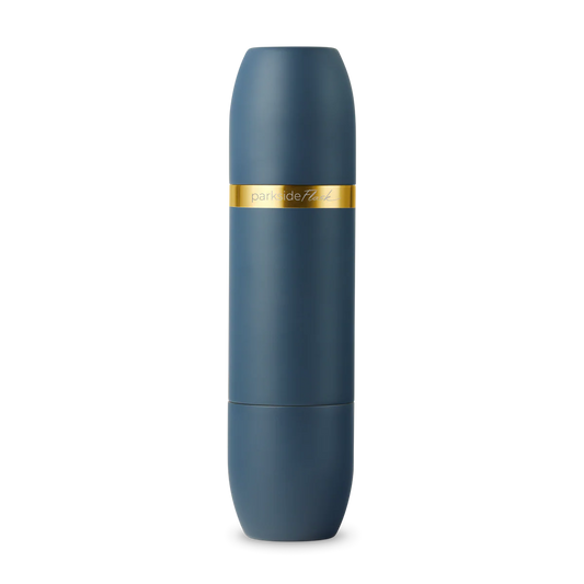 Blue cylindrical container with a gold band on a white background