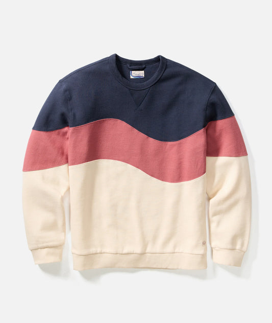 Color-blocked sweatshirt with navy, red, and beige sections on a light gray background