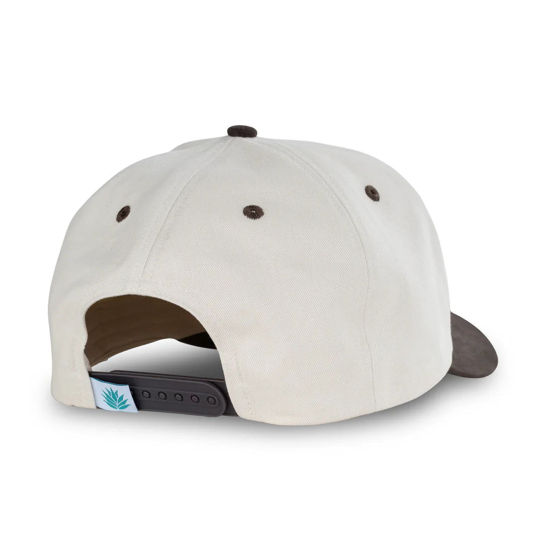 Back view of a beige cap with brown accents on a white background
