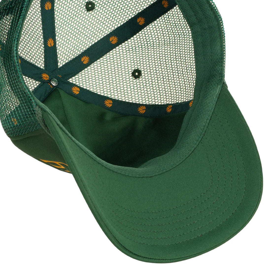Green cap with mesh back and embroidered details on a white background