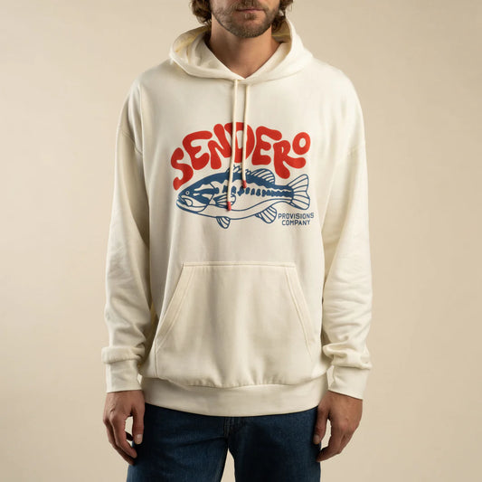 Person wearing a white hoodie with 'Sendero' logo on a beige background