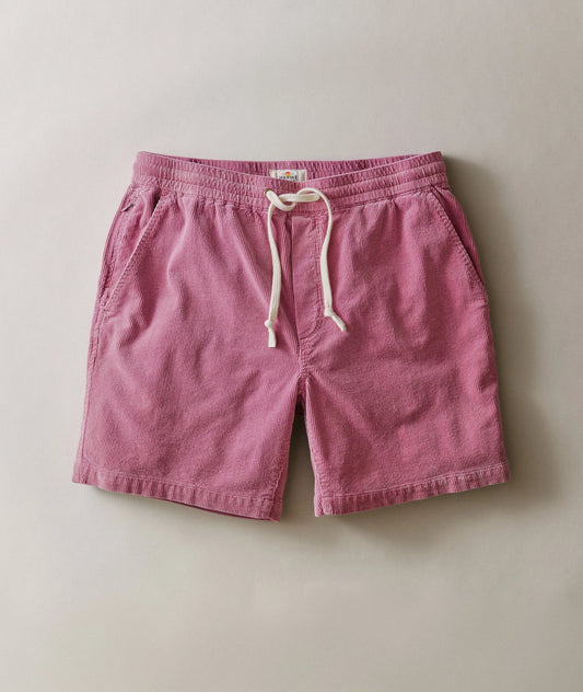 Pink shorts with a drawstring on a beige background