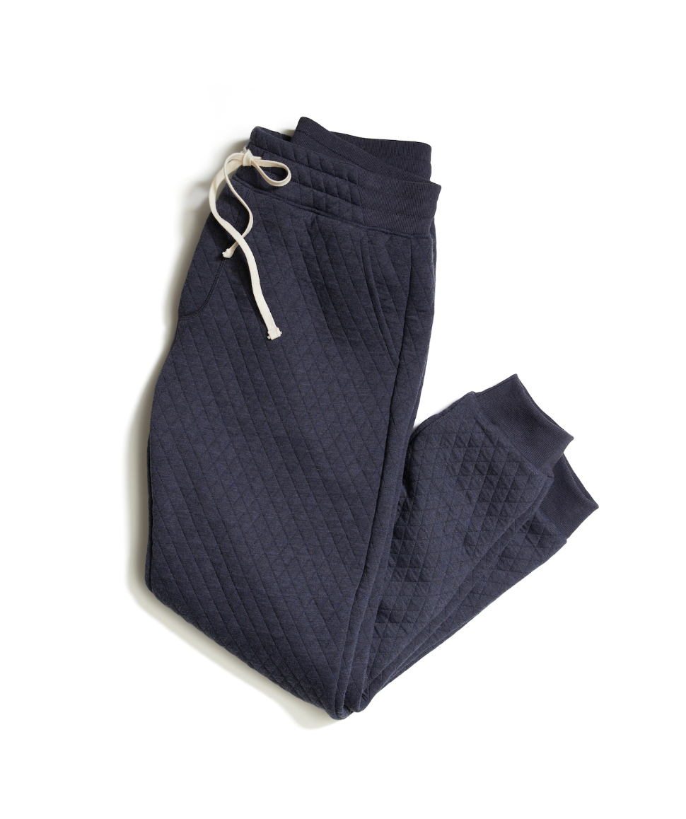 Dark blue textured pants with a white drawstring on a white background