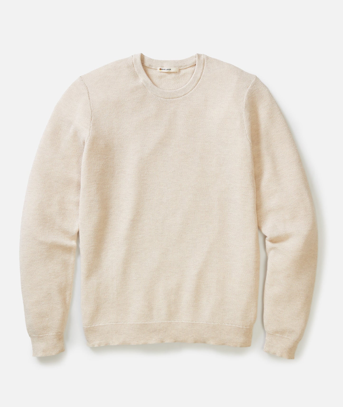 Beige sweater on a white background