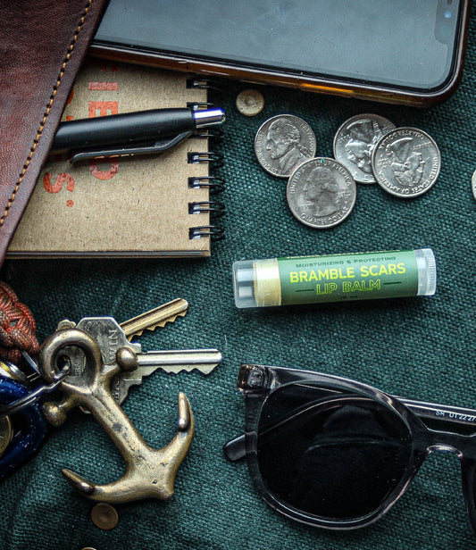 natural moisturizing lip balm among other small items found in a purse