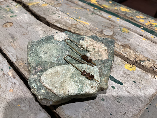 Decorative stone with a small figurine on a wooden surface