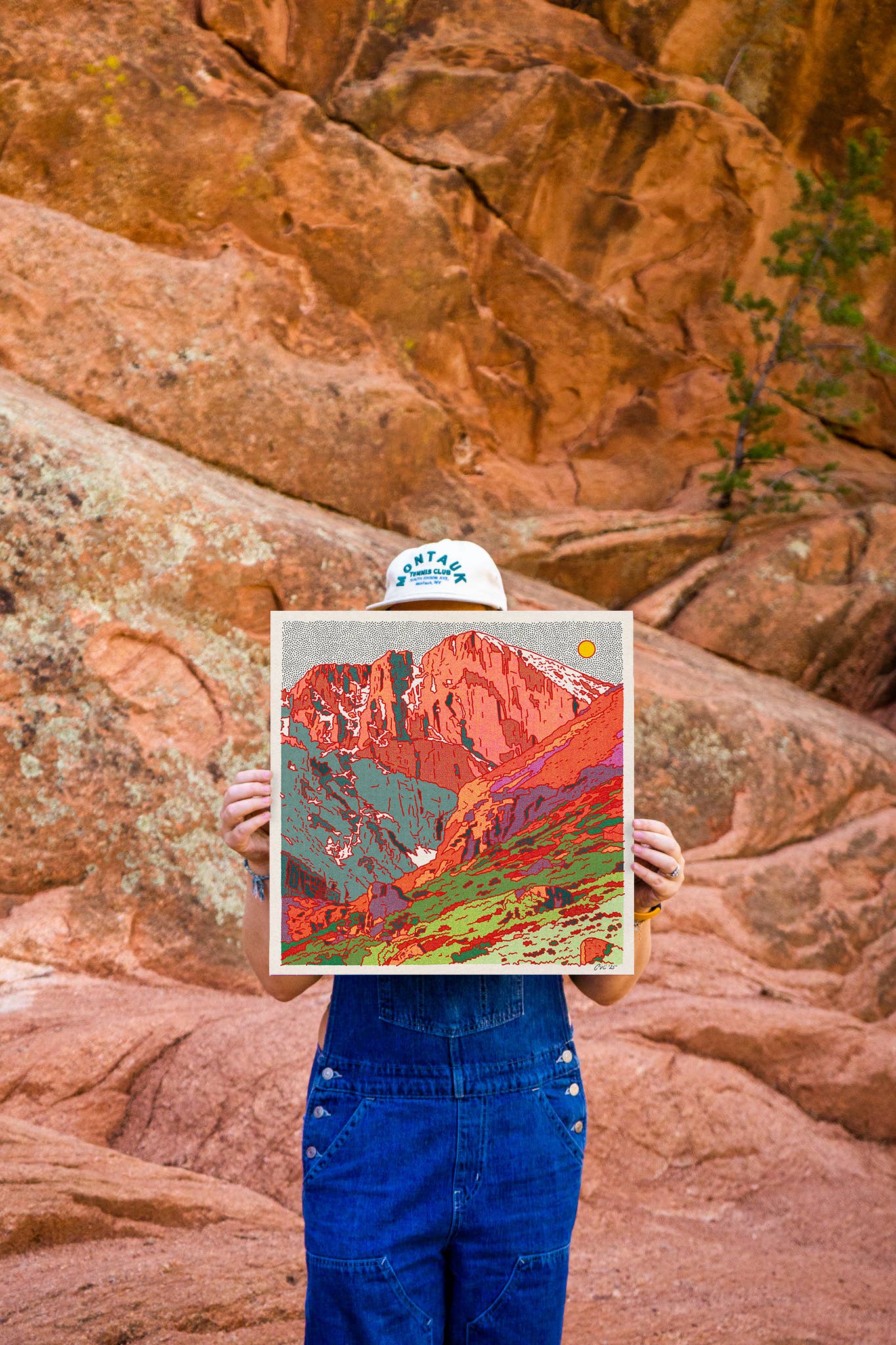 caroline clark holding her artwork