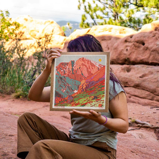 artist holding artwork caroline clark