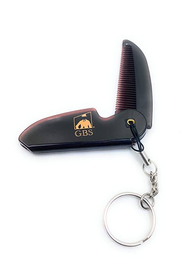 Black comb and knife set with keychain on a white background, featuring the GBS logo.