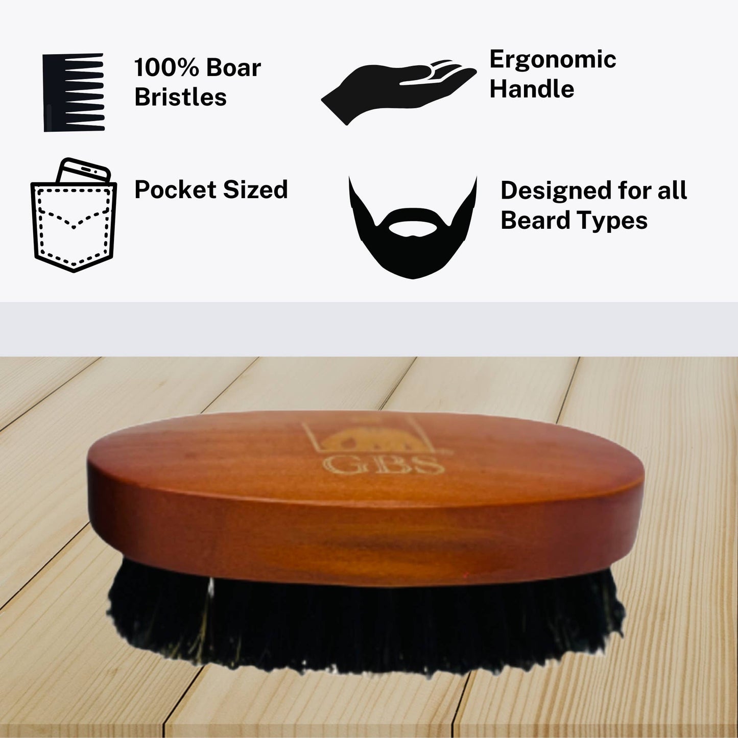 Wooden beard brush with black bristles on a wooden surface, featuring GBS branding.