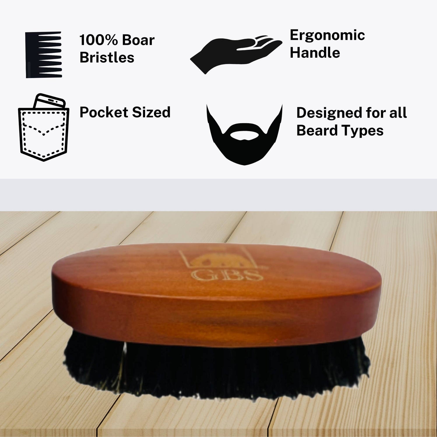 Wooden beard brush with black bristles on a wooden surface, featuring GBS branding.