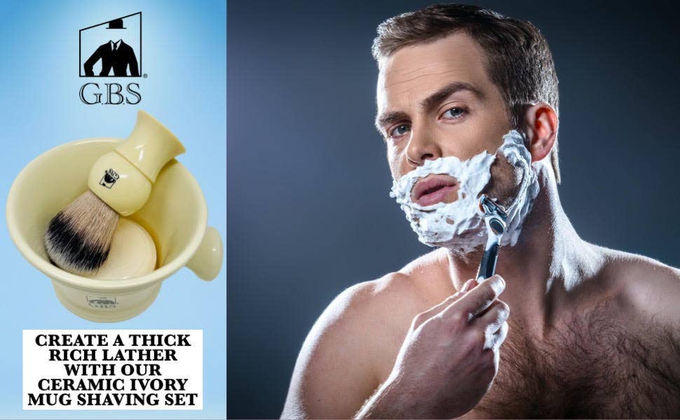 Man shaving with GBS ceramic ivory mug shaving set on a dark background
