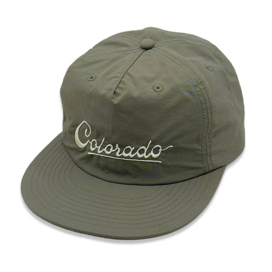 Green cap with 'Colorado' embroidery on a white background