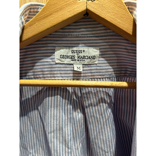 Striped shirt with a Guess label on a wooden hanger