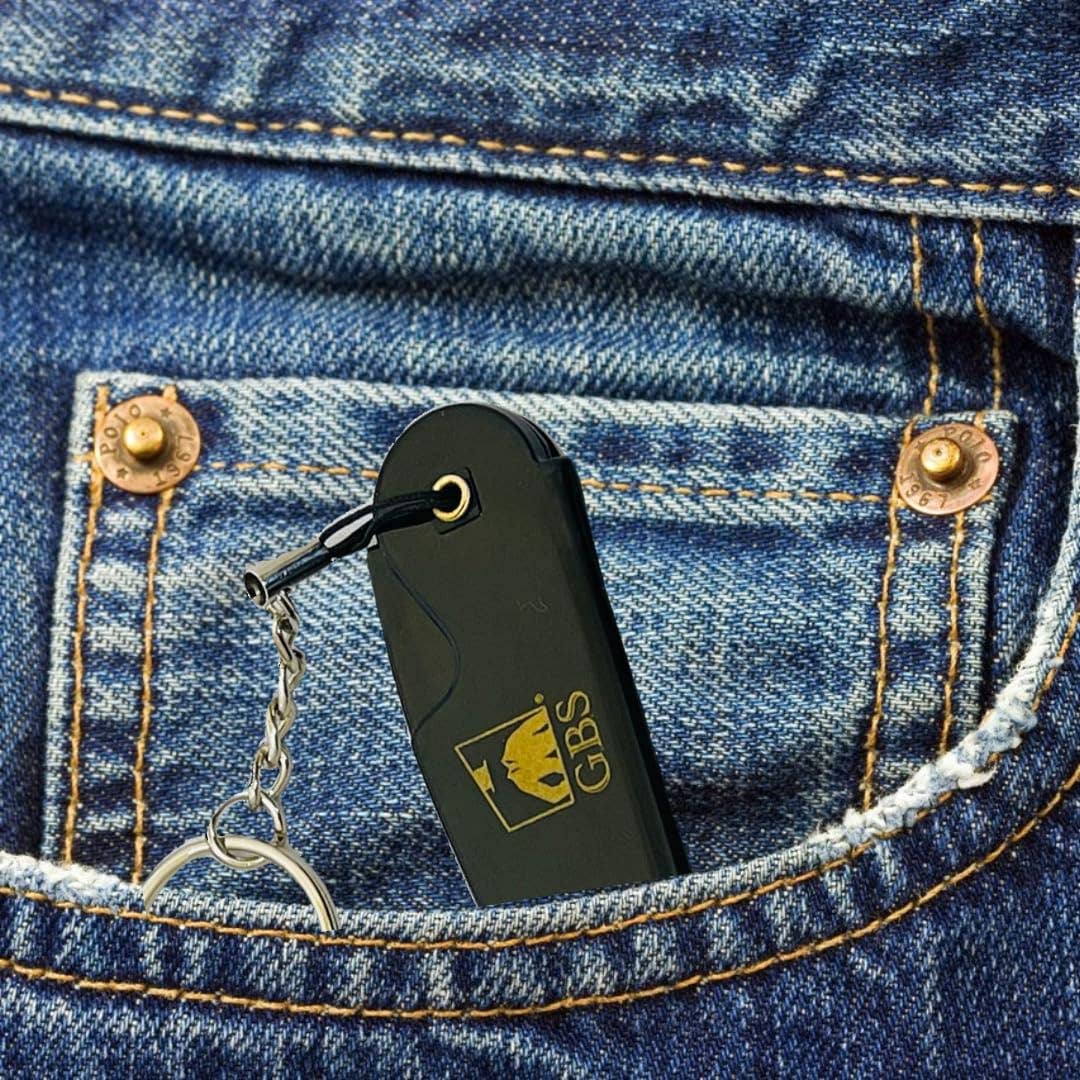 Black lighter with a keychain attached to a blue denim pocket.