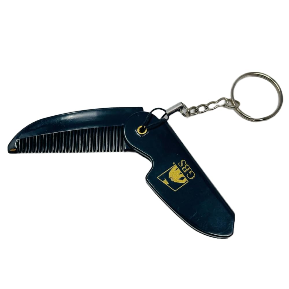 Black comb with keychain on a white background