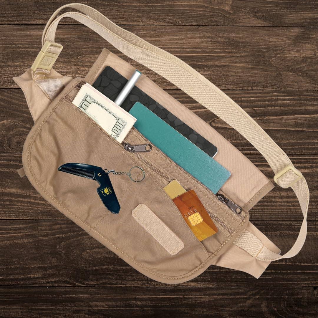 Beige waist bag with items like a knife, money, and cards on a wooden surface