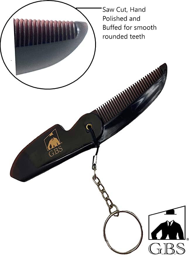 Black folding comb with keychain attachment on a white background, featuring GBS branding.