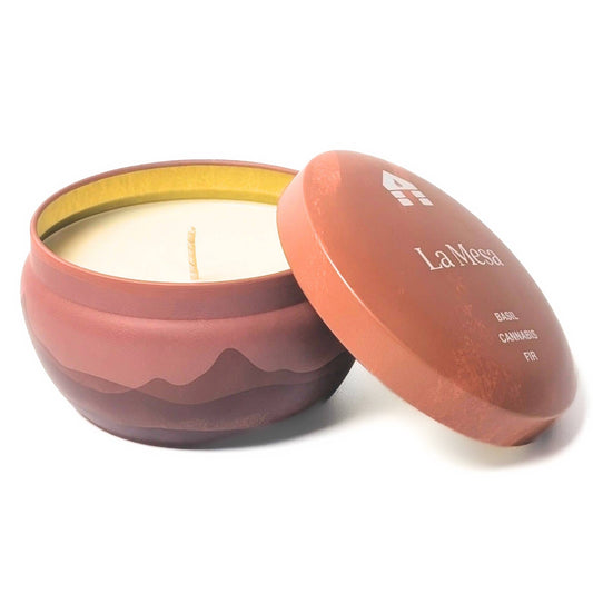 Ceramic candle with wavy design and 'La Mesa' branding on a white background