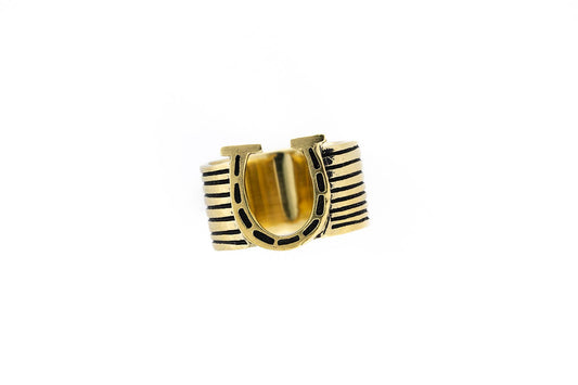 Gold ring with black stripes on a white background