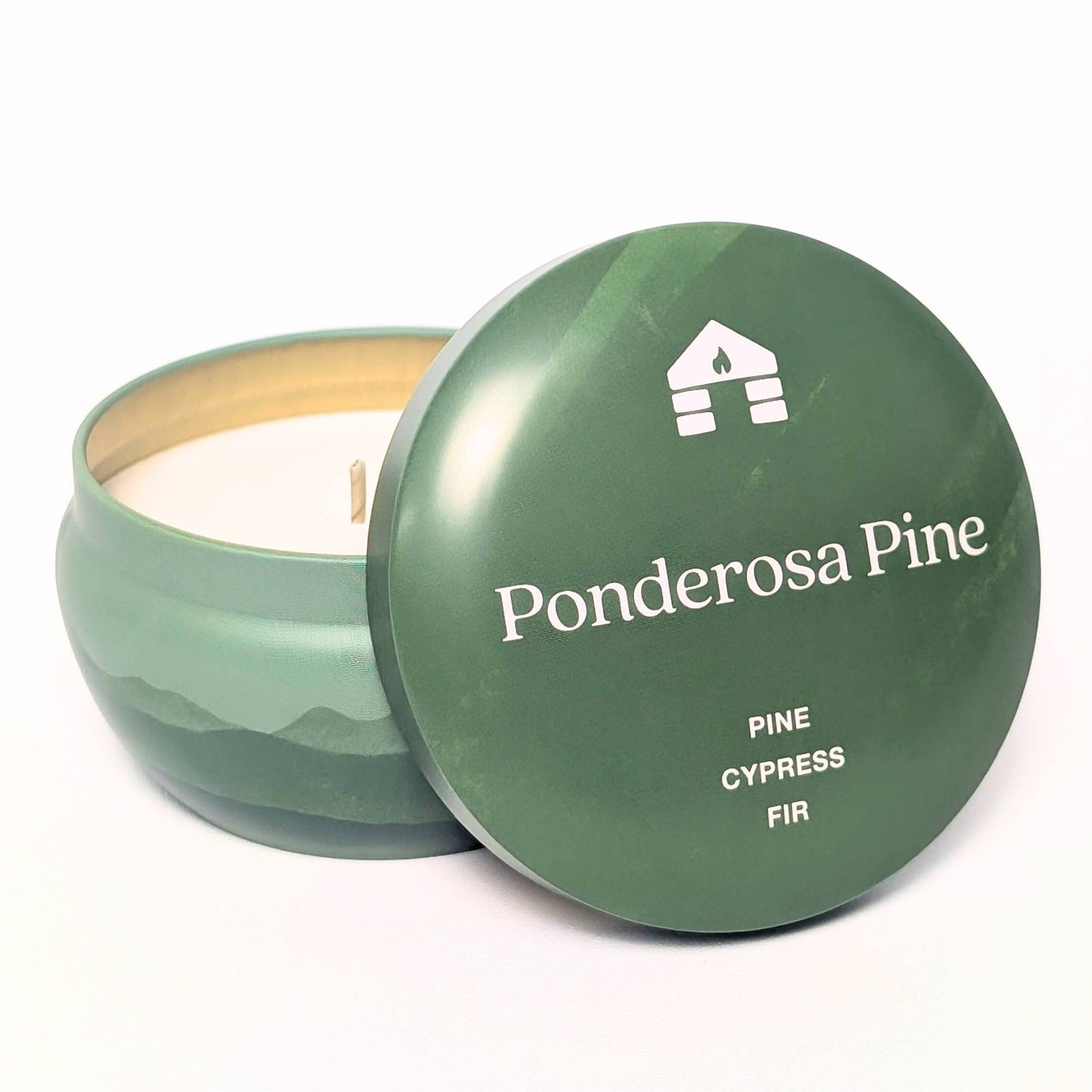 Green candle in a container with 'Ponderosa Pine' branding on a white background