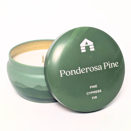 Green candle in a container with 'Ponderosa Pine' branding on a white background