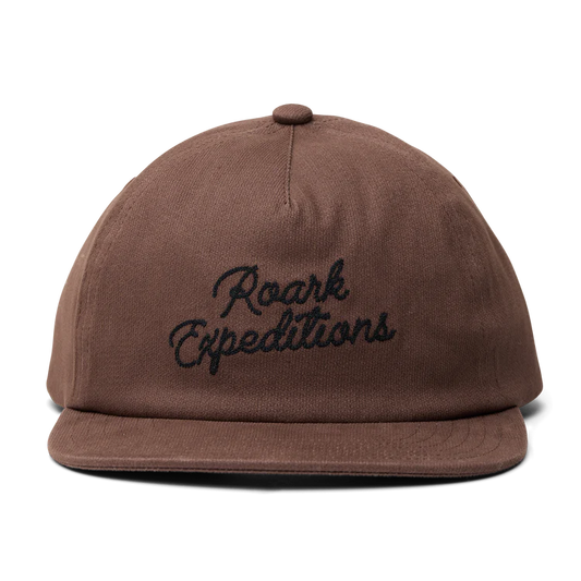 Brown cap with 'Roark Expeditions' embroidery on a white background