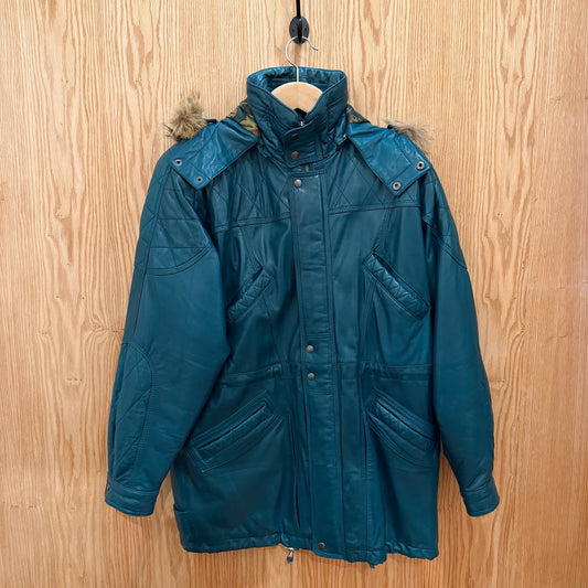 Blue winter coat with fur-lined hood on a wooden hanger against a wooden background