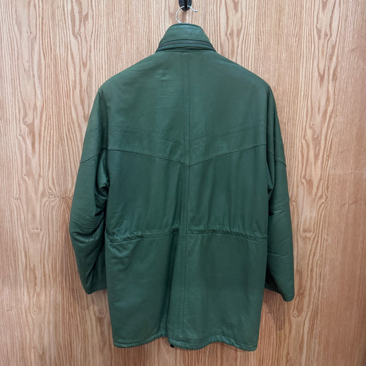 Green jacket on a hanger against a wooden background