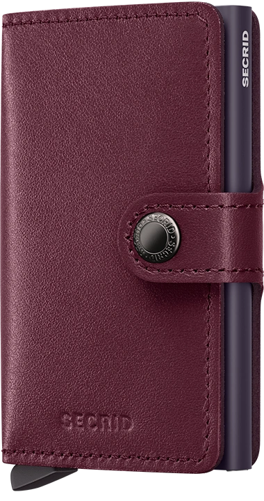 Burgundy leather wallet with metallic clasp and 'Secrid' branding on a white background