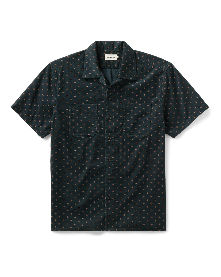 Dark patterned short-sleeve shirt on a white background