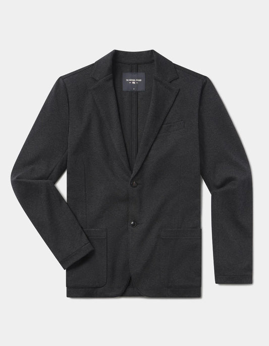 Black blazer on a light gray background